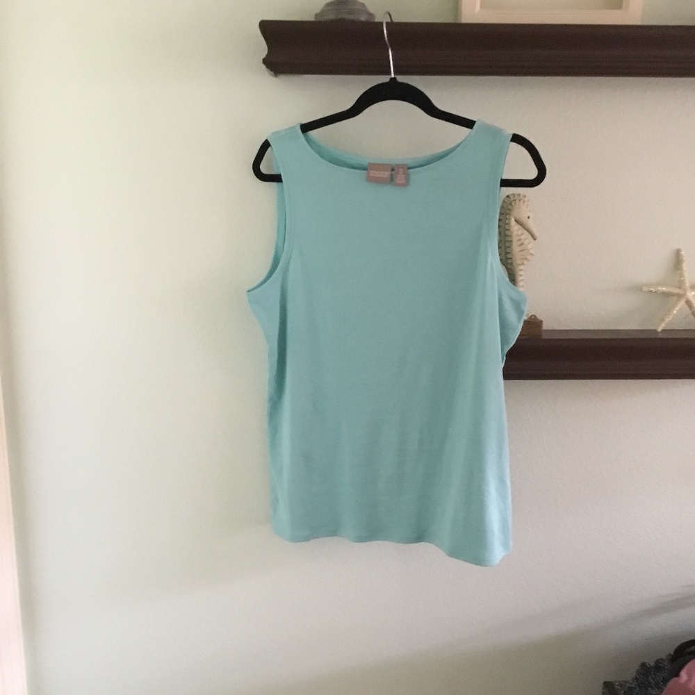 Chico  size 1 and 2 woman’s sleeveless top. Light teal   M and L